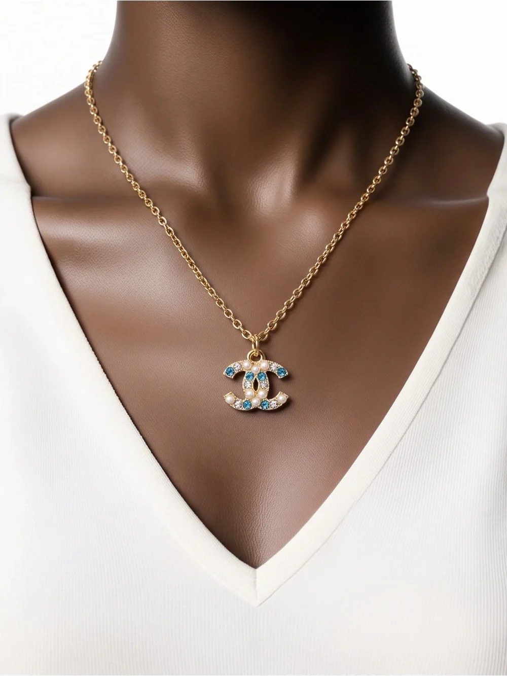 Gold Chain Necklace with Blue and Clear Gemstone Pendant